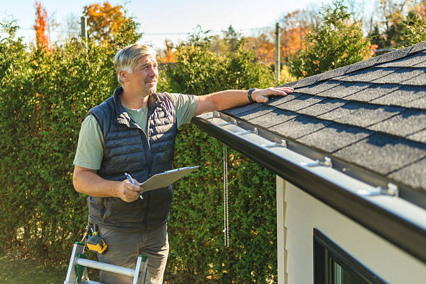 Professional Storm Damage Roof Repair technician working in Abilene, KS